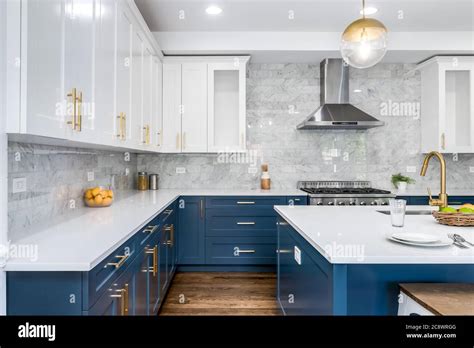 blue kitchen cabinets stainless steel appliances|blue kitchen cabinets white countertop.